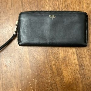 Women’s black fossil wallet, green interior.